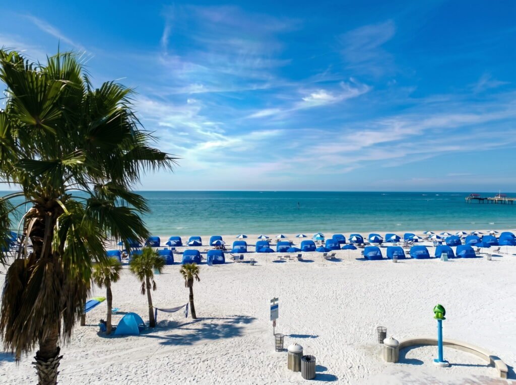 Clearwater Beach Florida with golden sand, pier, and stunning Gulf sunset, one of the top-rated beaches in Florida