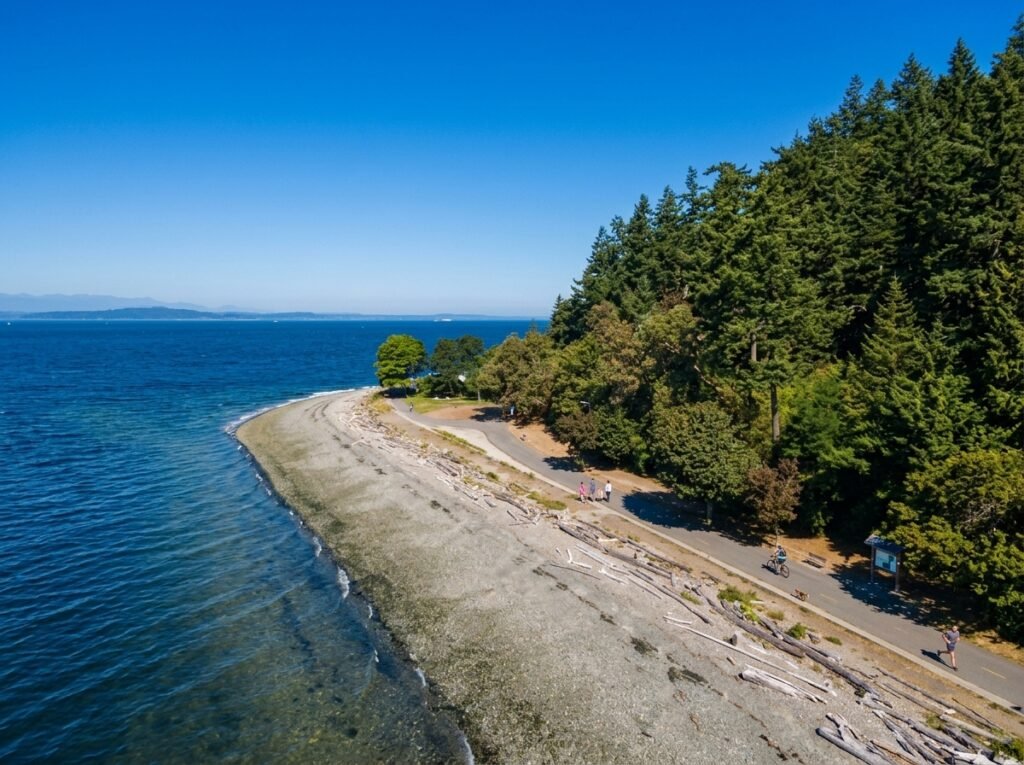 Waterfront park with a playground and view of passing ferries